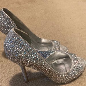 Rhinestone encrusted silver open toed high heels